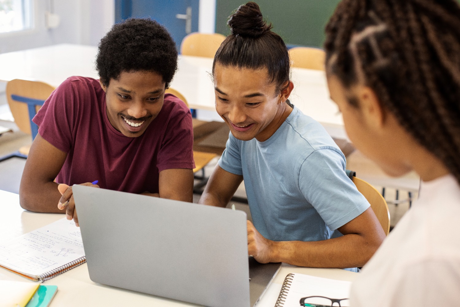 students collaborating on a computer